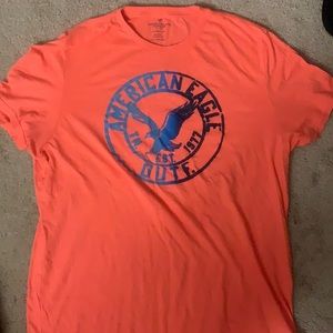 American Eagle Salmon Colored Shirt with Blue logo, size is XXL, classic fit